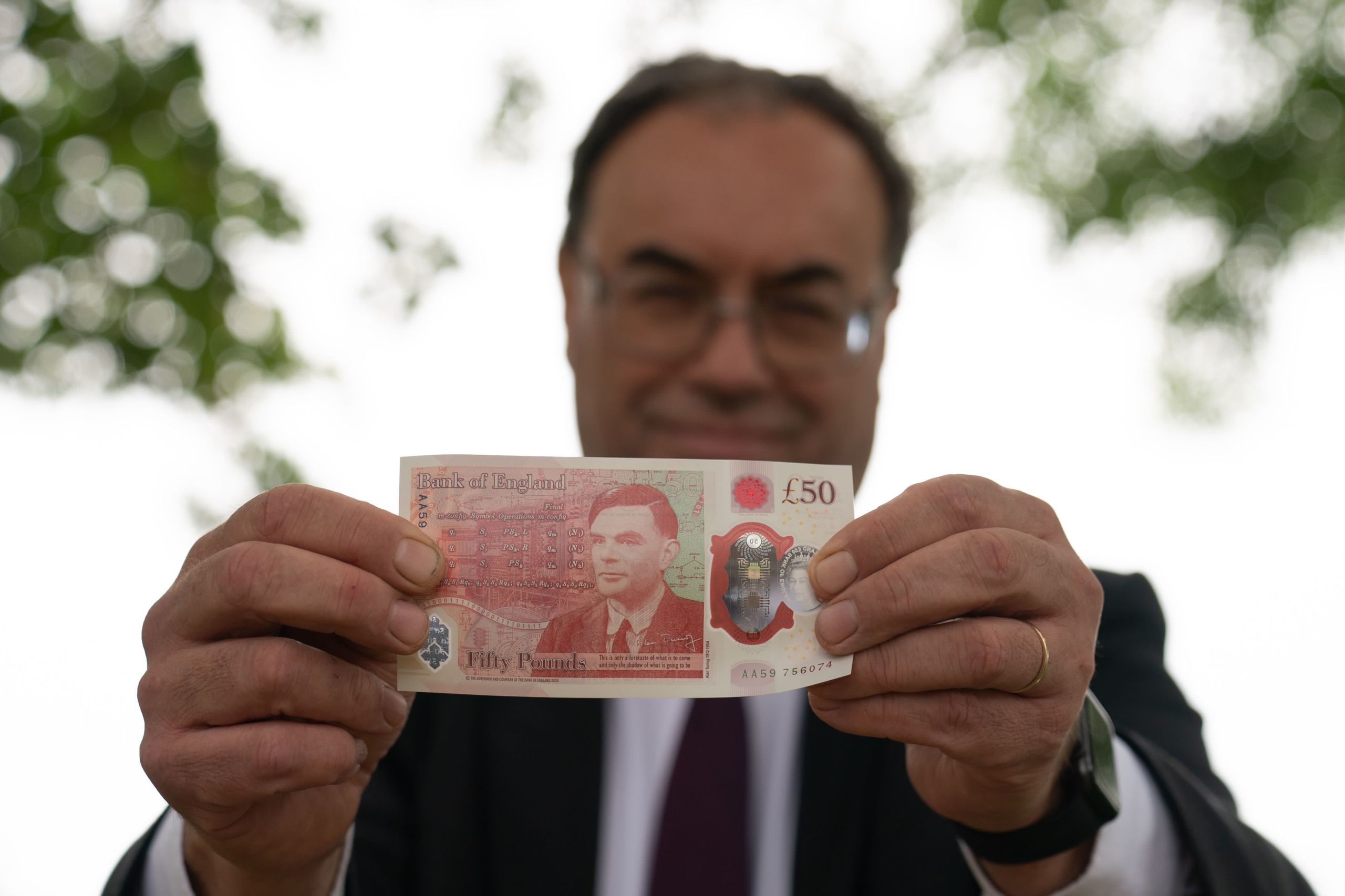 Photo of Dr Bailey with one of the new notes