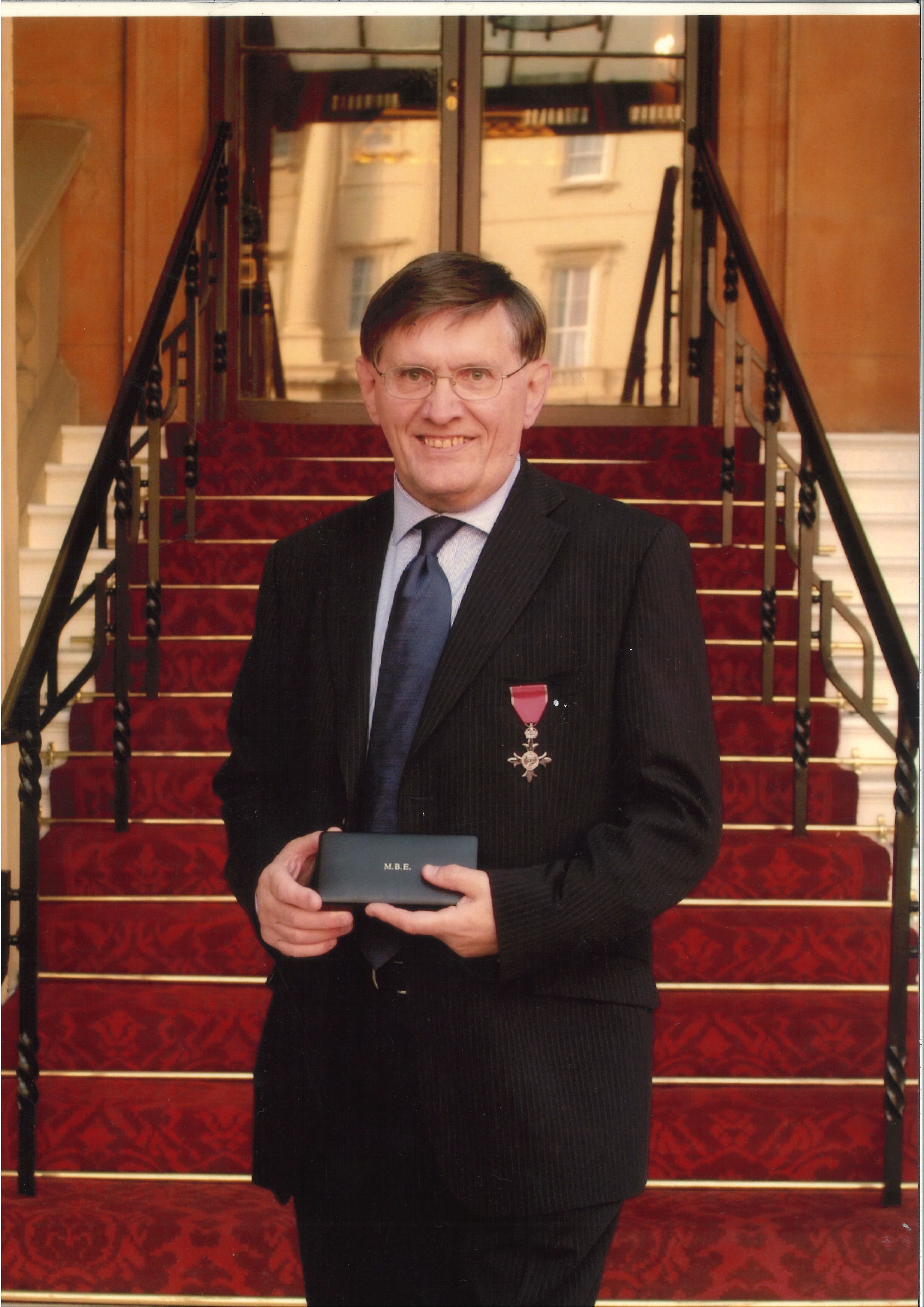 Garth Collard with his MBE award