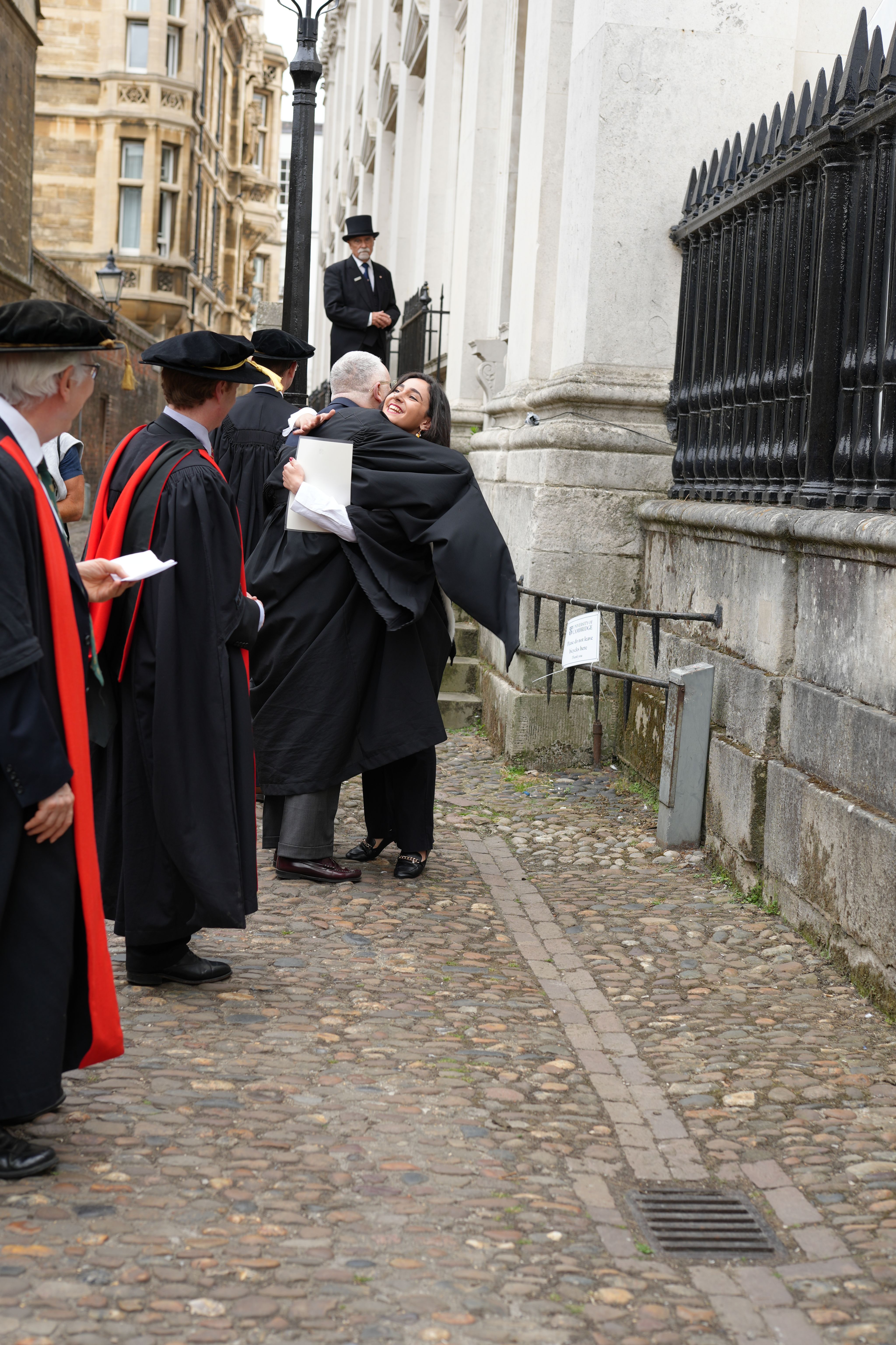 People hugging outside Senate House