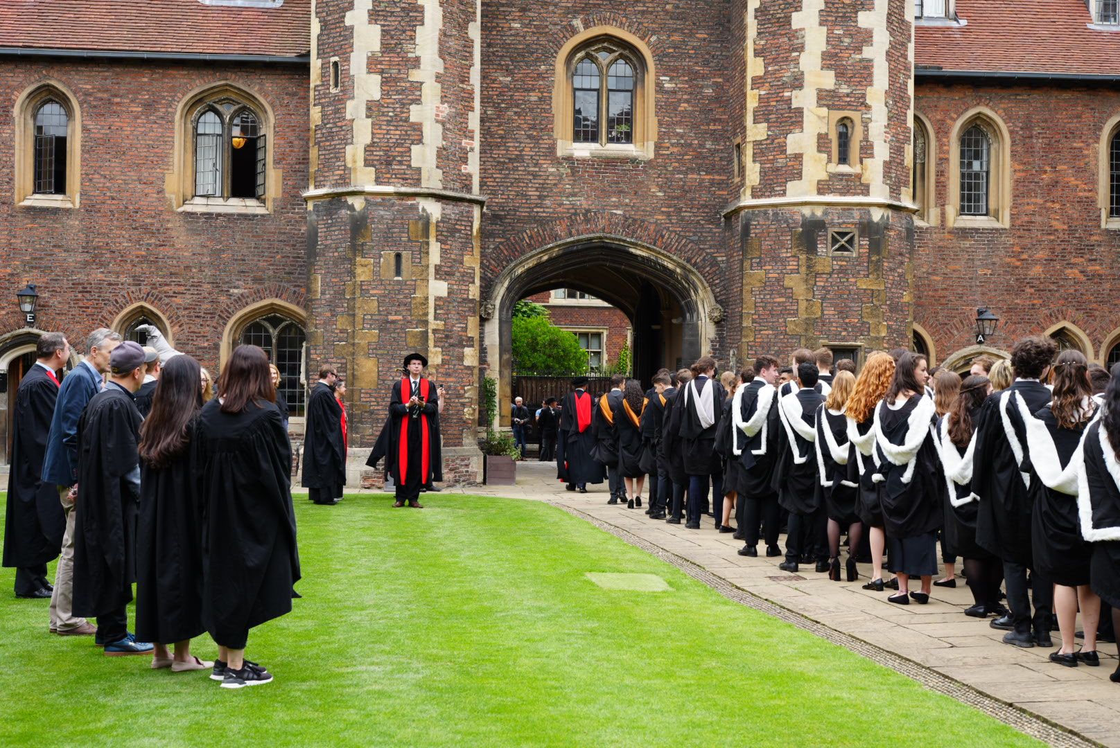Queens' students lining up to walk to the graduation event