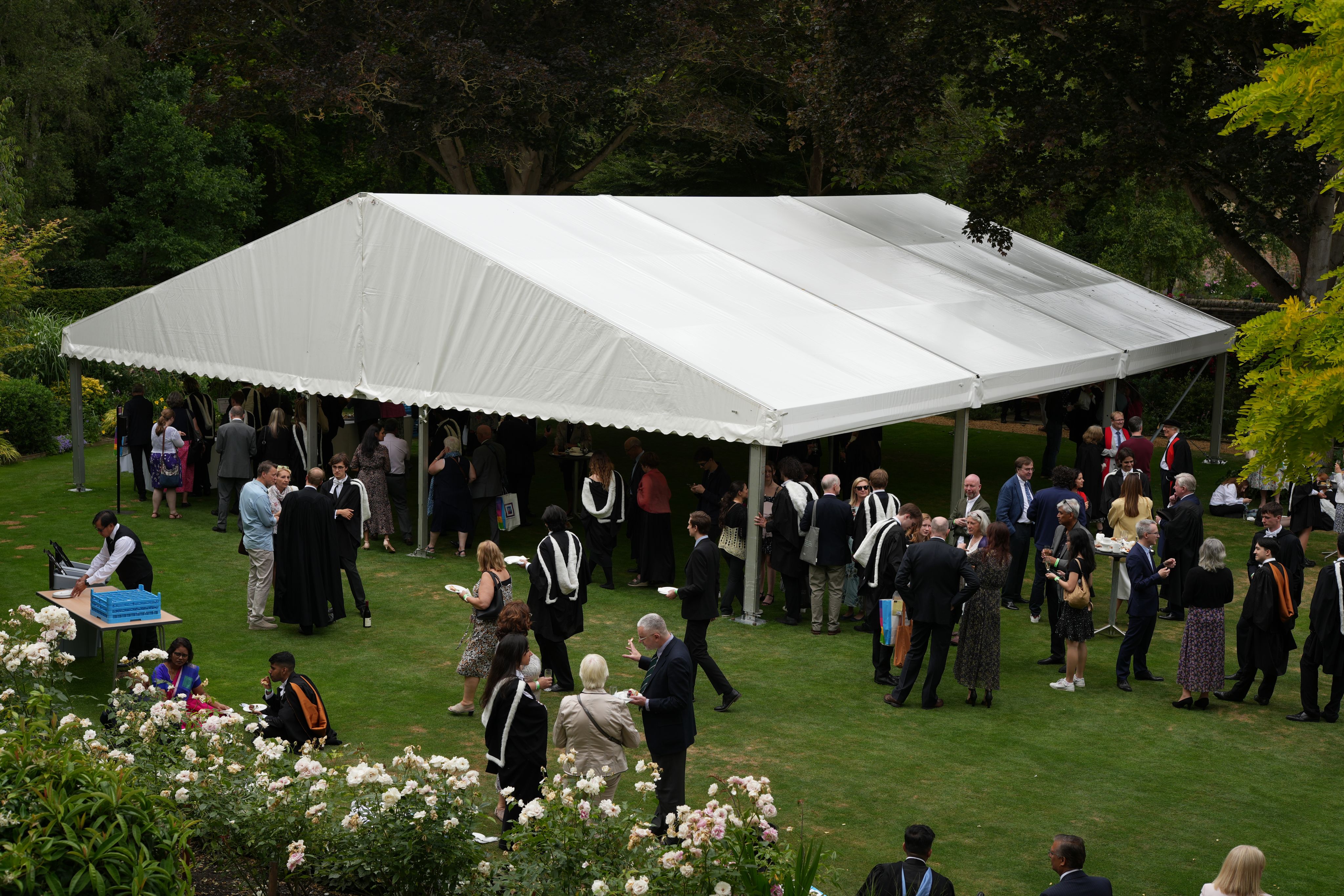 People outside under marquee