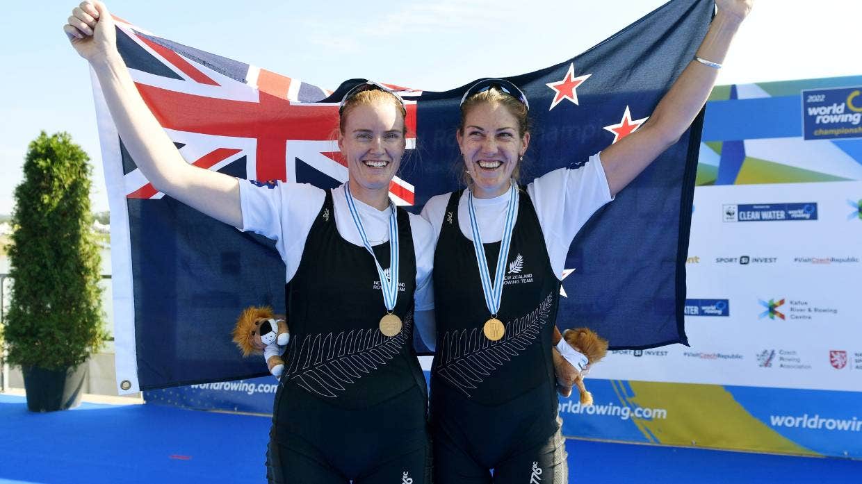 Two athletes with medals.