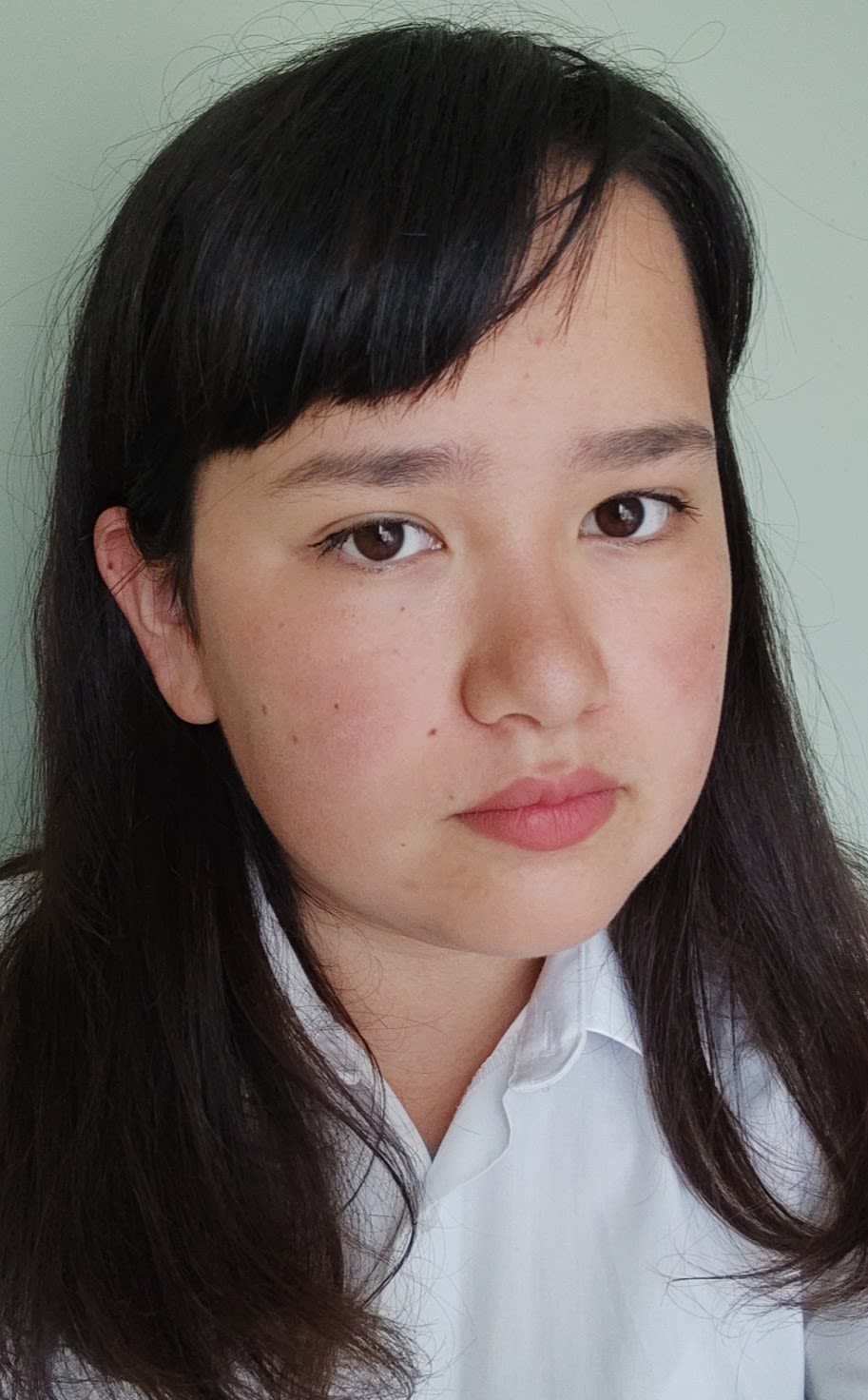 Girl with dark hair taking selfie