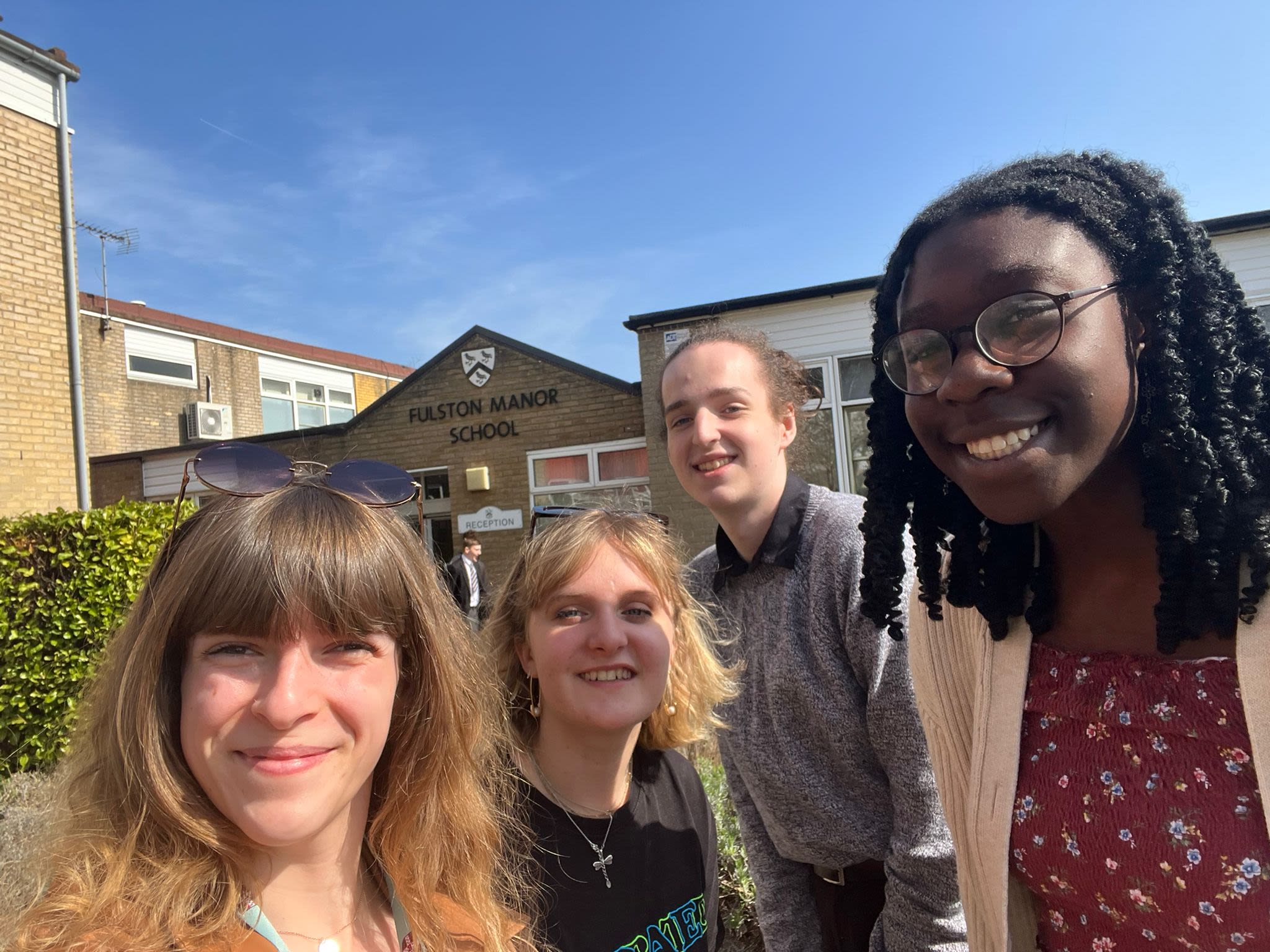 A group of four students at Queens' roadshow