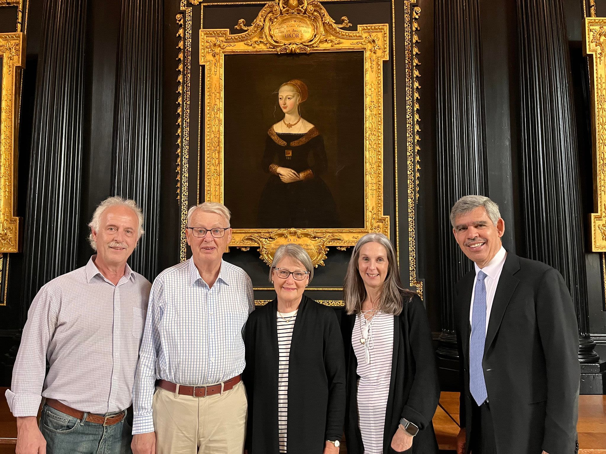 Group of people in front of a medieval portrait