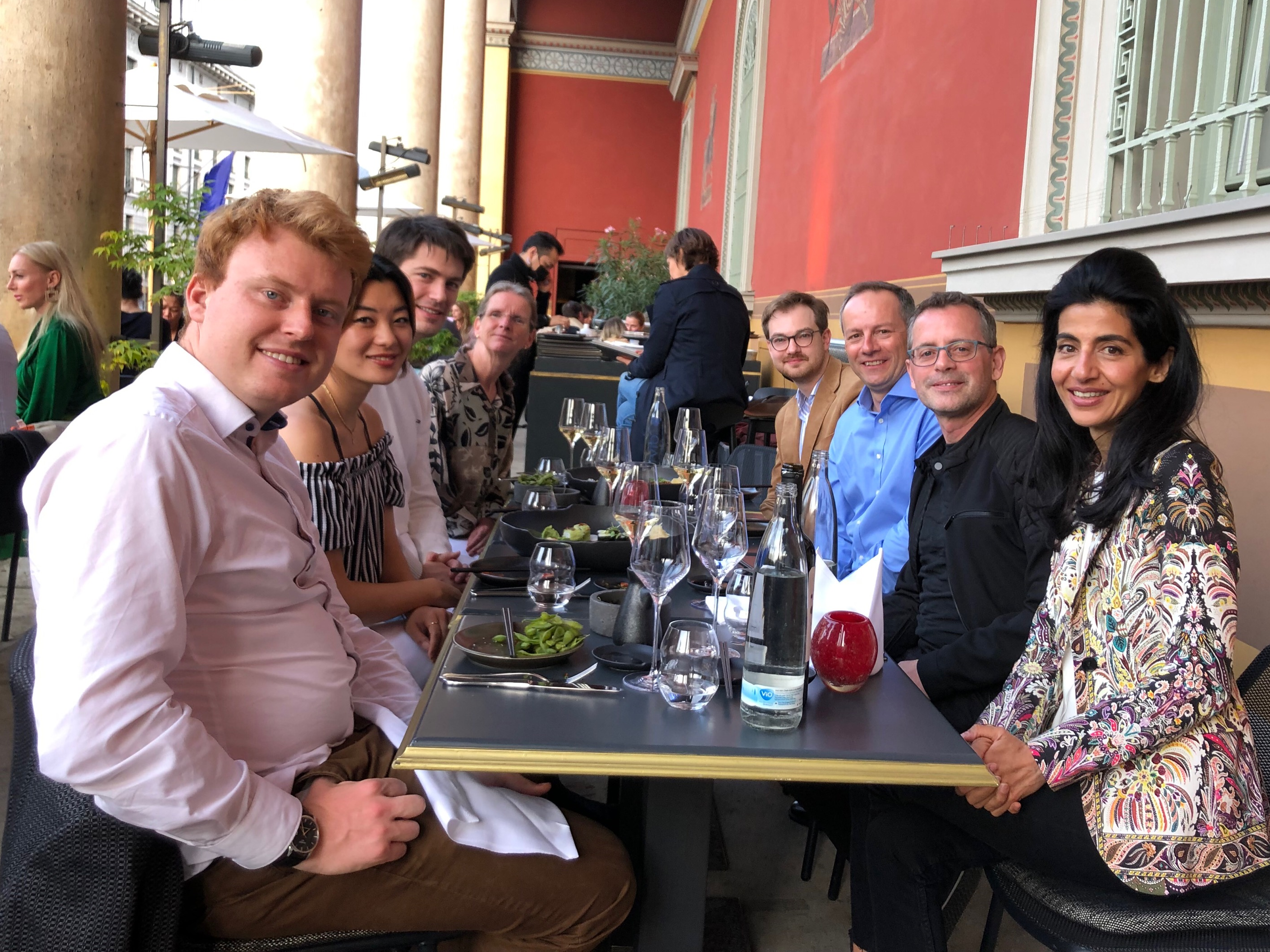 A group of people sat around a table for drinks