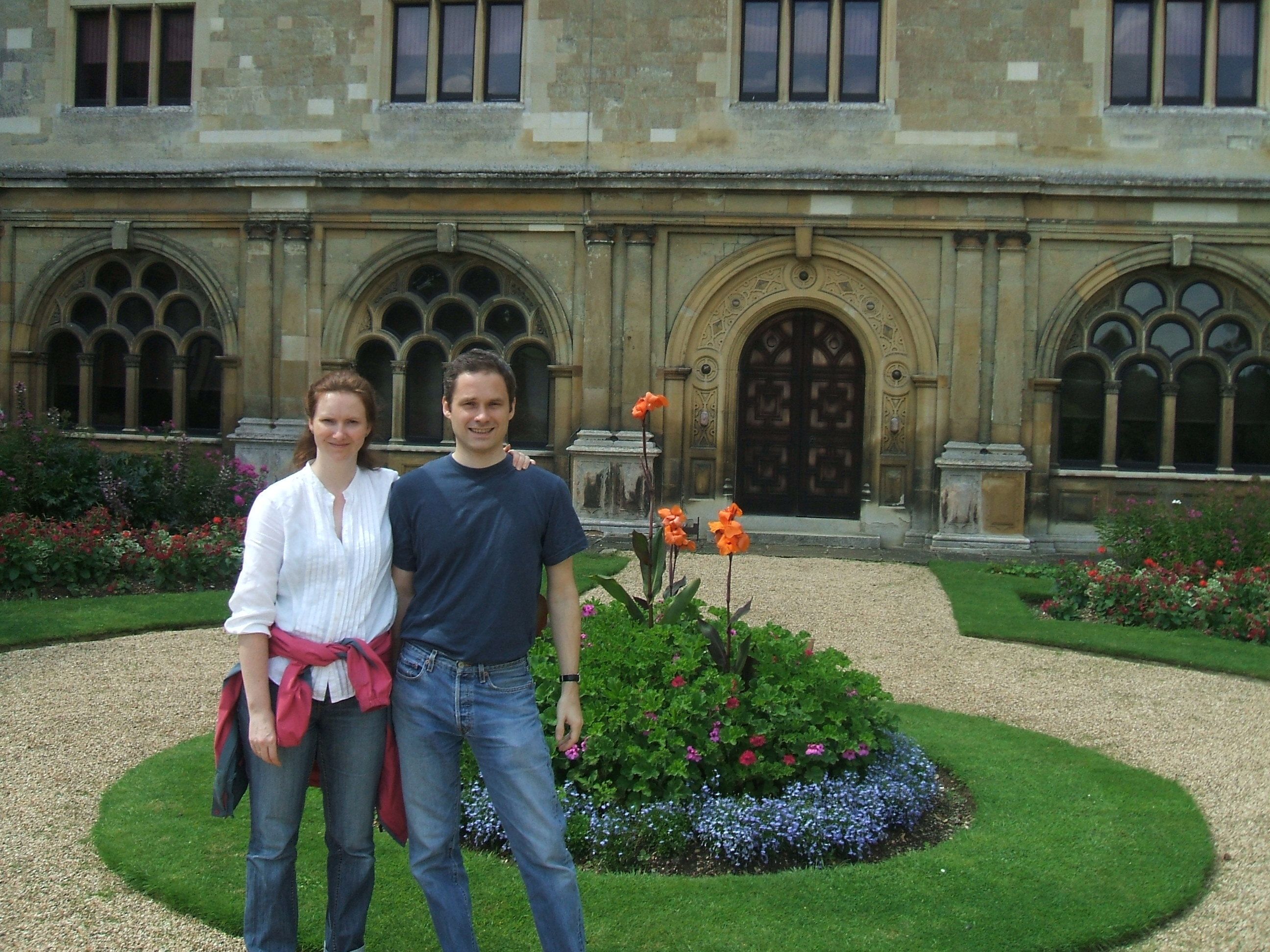 A couple posing outside a period building