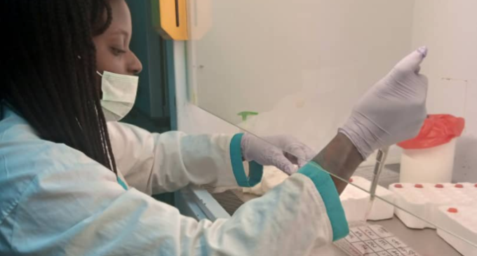A woman conducting work in a lab