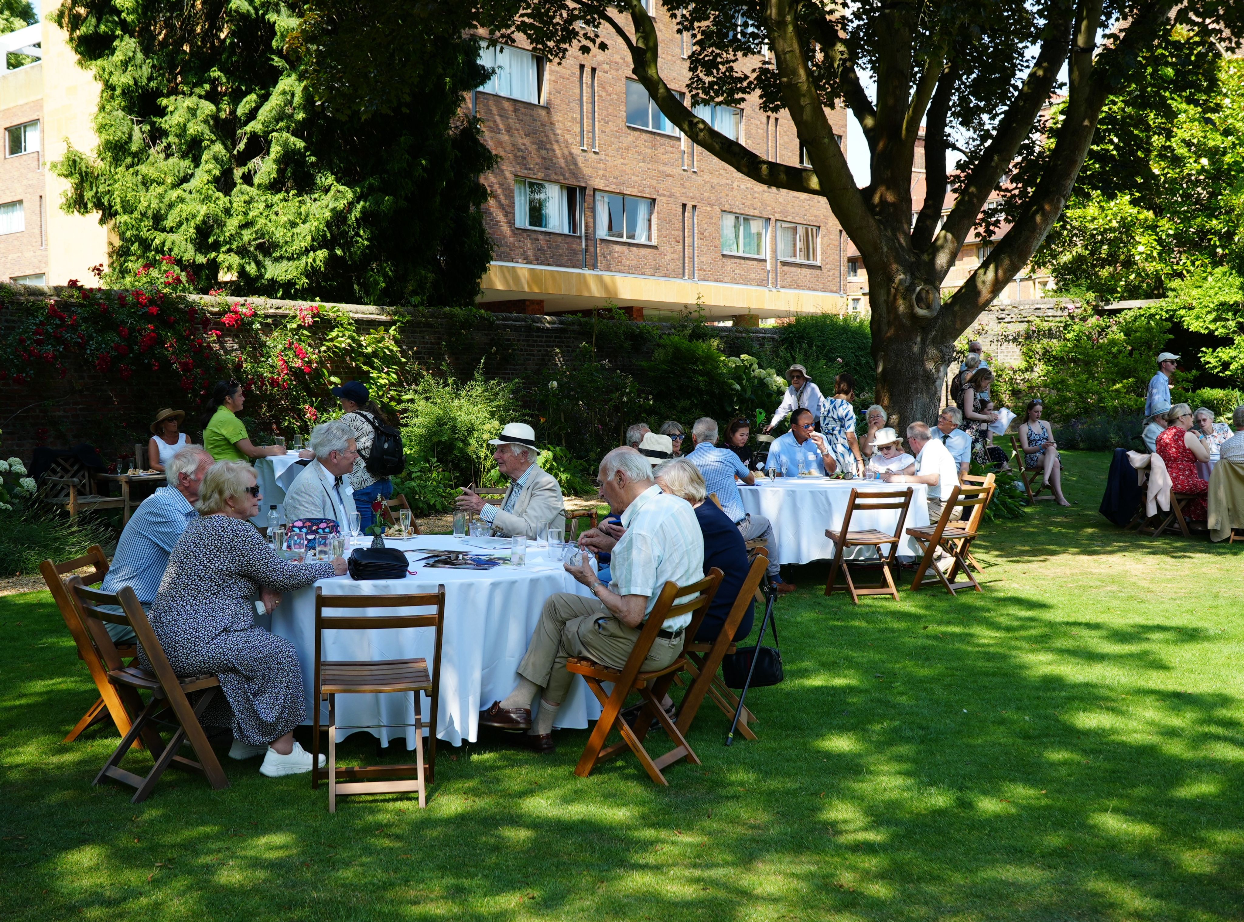 A group of people gathered around tables